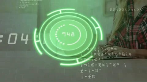 Woman typing timer counting and updating green HUD numbers showing live stats Stock Footage 328485452