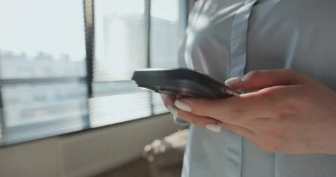 Woman typing using mobile phone. Using social media application on smartphone 動画素材 335885073