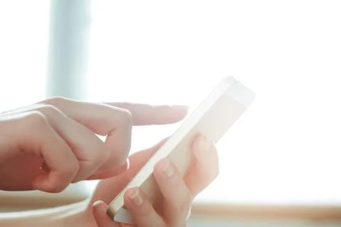 Woman typing write message on smart phone Stock Photos