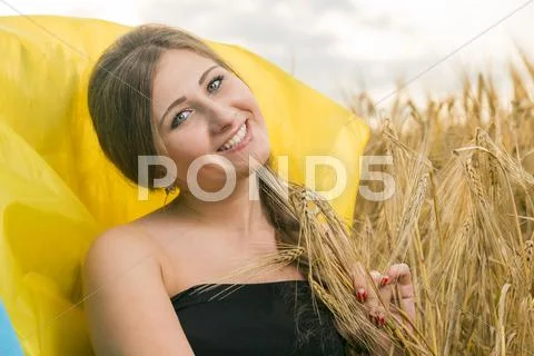 Woman with a ukrainian flag Stock Photos