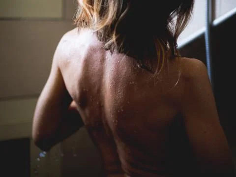 Woman under the shower Stock Photos