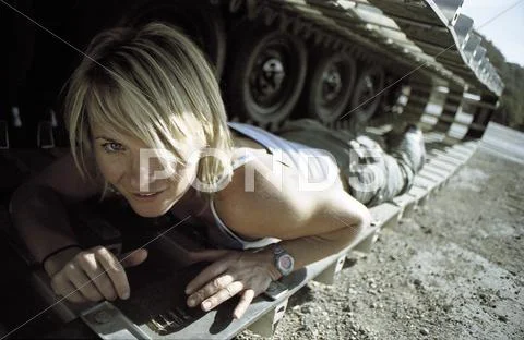Woman under a tank Stock Photos
