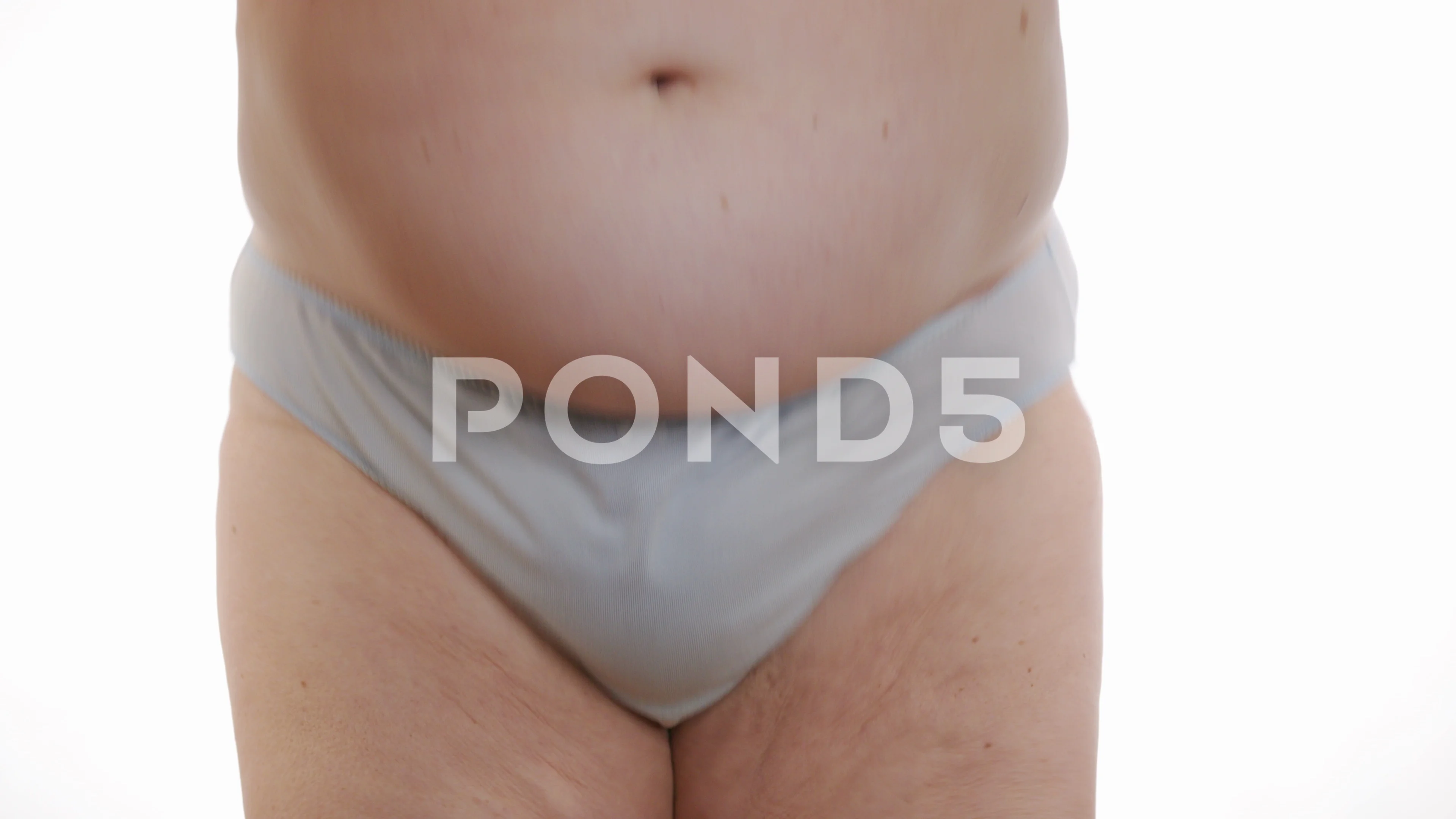 Woman in white underwear holds her belly fat. Stock Video Footage by ©kotin  #202898944