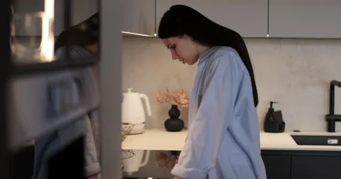 Woman is upset and crying while standing in the kitchen after a family quarrel. Video stock 302270766