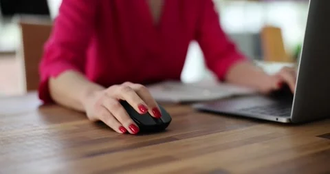 Woman use computer mouse working on computer at table closeup Stock Footage 260795810