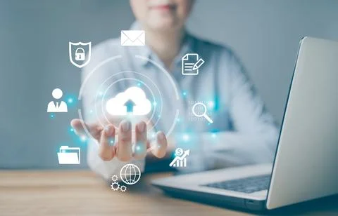 Woman use Laptop with cloud computing diagram show on hand. Cloud technology. Stock Photos