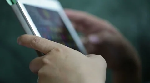 Woman use mobile device while relaxing on a sofa. Stock Footage 64050619