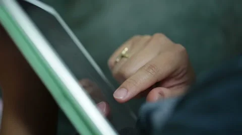 Woman use mobile device while relaxing on a sofa. Stock Footage 64050621