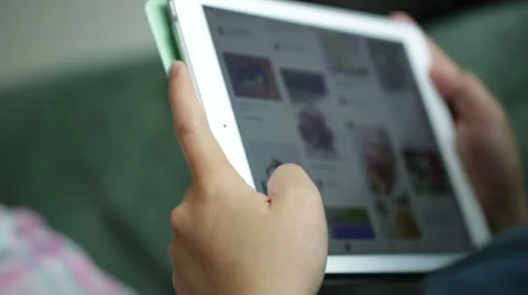 Woman use mobile device while relaxing on a sofa. Stock Footage 64050622