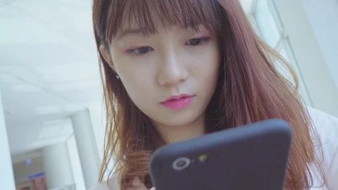Woman use of mobile phone in the city Stock Footage