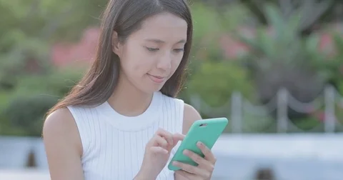 Woman use of mobile phone Stock Footage