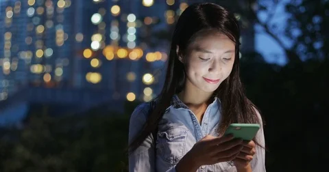 Woman use of mobile phone at outdoor Stock Footage
