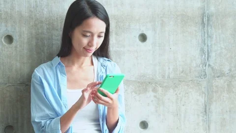 Woman use of mobile phone at street Stock Footage