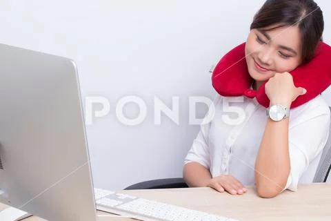 Woman use pillow for relax in the office Stock Photos