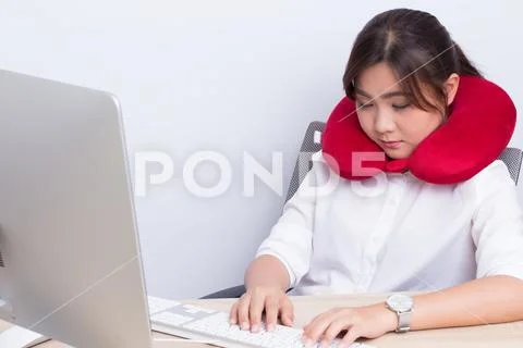 Woman use pillow take a nap at office Stock Photos
