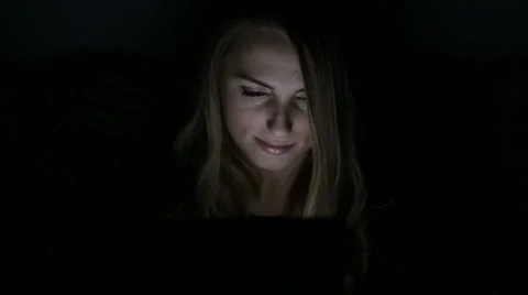 Woman use tablet computer at night Stock Footage 68978880