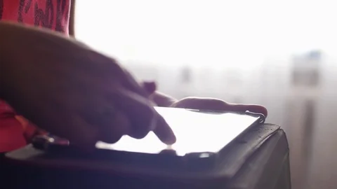 Woman uses digital tablet browsing internet and watching video on tablet PC with Stock Footage 76232469