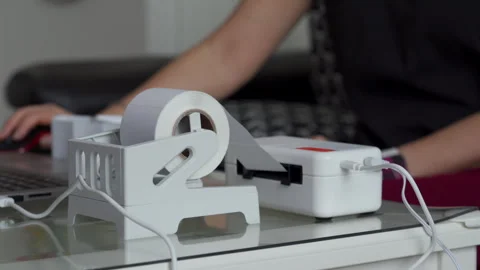 Woman Uses Label Printer for Streamlined Business Tasks at Home Office Stock Footage 310653533