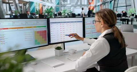 Woman Uses Software On Computer To Analyze Vendor Risk And Compliance. Stock Photos