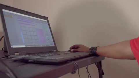 Woman uses studio software to record music in her home recording studio Stock-Footage 124295950
