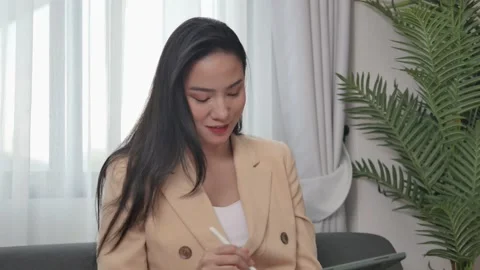Woman uses on tablet to draft content, present work project to client. Stock-Footage 198111924