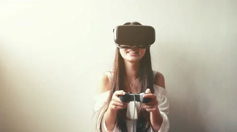 Woman uses a virtual reality glasses Stock Footage