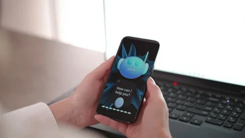 Woman Using AI Chatbot on Mobile Phone at Work Modern Business Communication Stock Footage 335871900