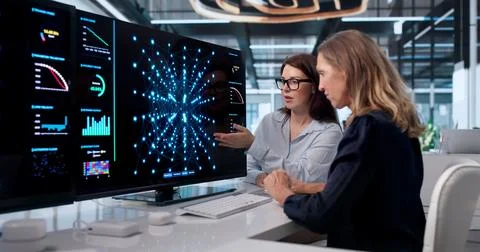 Woman Using AI Tools On Computer To Analyze Data And Build Models. Stock Photos