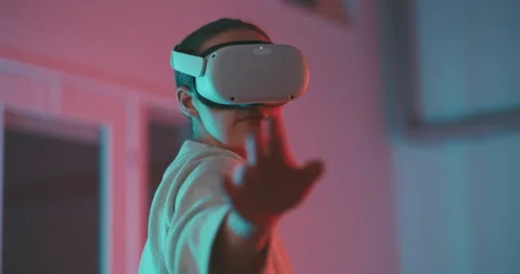 Woman using and experimenting virtual reality goggles Stock Footage 201116179