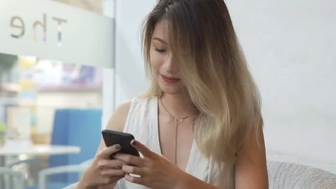 Woman using app on smartphone Stock Footage 79255754