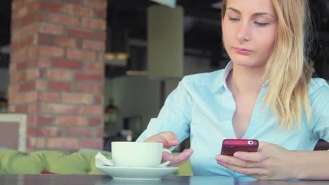 Woman using app on smartphone smiling and texting on mobile phone Stock Footage 74396994