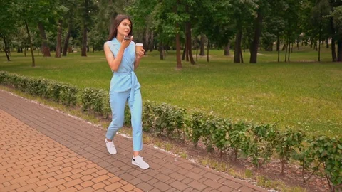 Woman using app voice helper on the run Stock Footage 129906749