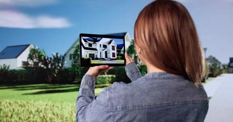 Woman Using AR Technology To Visualize House Construction Professionally Stock Photos
