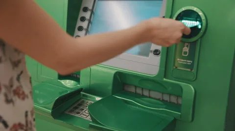Woman using atm Stock Footage 53764640
