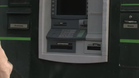 Woman using ATM machine to withdraw money Stock Footage 45871740
