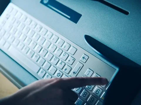 Woman using atm Stock Photos