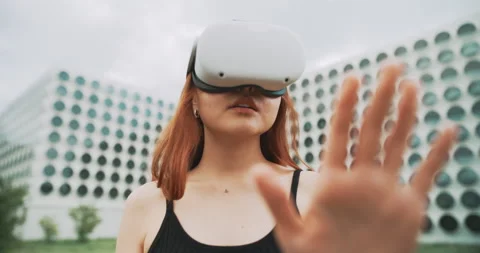 A woman using augmented reality glasses in the city Stock Footage 201118799