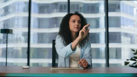 Woman using augmented reality software interface for business in office close up Foto stock