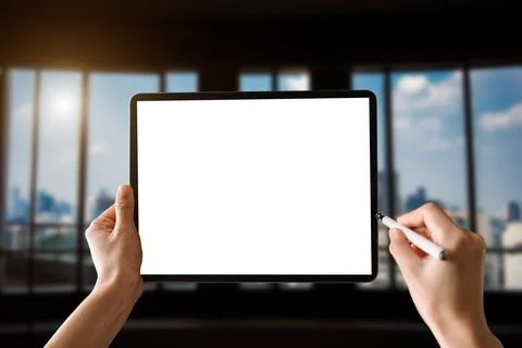 Woman using blank screen tablet with stylus Foto stock