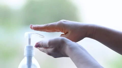 Woman using bottle of antibacterial sanitiser soap Stock Footage 127012648