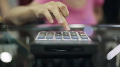 Woman using a calculator Stock Footage 51257111