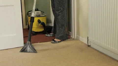 Woman using a carpet cleaner Video stock 27166606