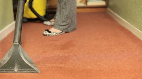 Woman using a carpet cleaner Video stock 27167567