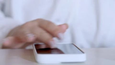 Woman is using a cell phone Stock Footage 327651258