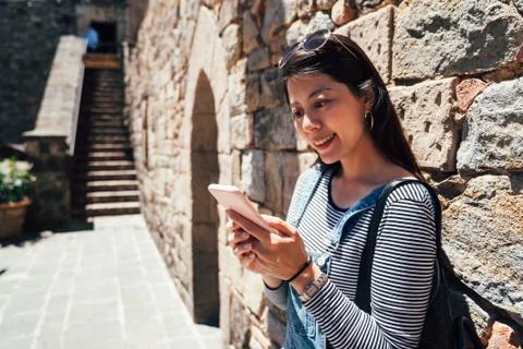 Woman using cellphone checking the information Stock Photos