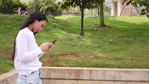 Woman using a cellphone Stock Footage 239120621
