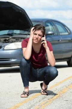 Woman Using Cellphone To Request Road Assistance Stock Photos