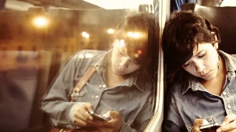 Woman using cellphone in the train Stock Footage 40000686