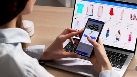Woman Using Computer And Phone To Shop Online Stock Footage 334534914