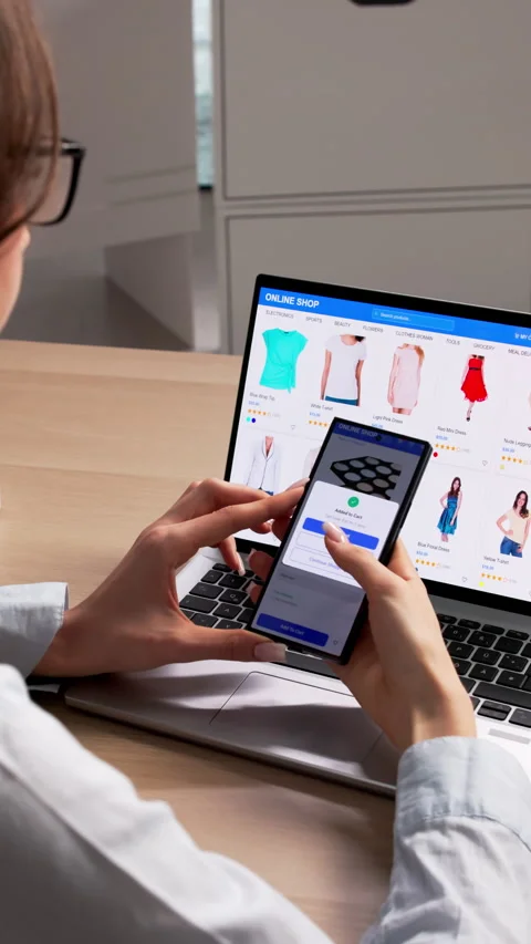 Woman Using Computer And Phone To Shop Online Stock Footage 335881374